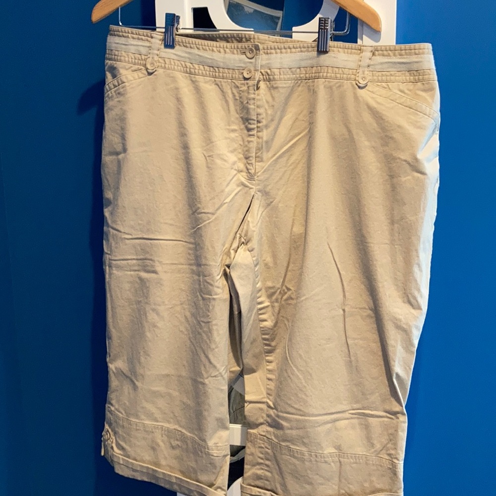 Women’s beige Capri pants with rolled up cuffs